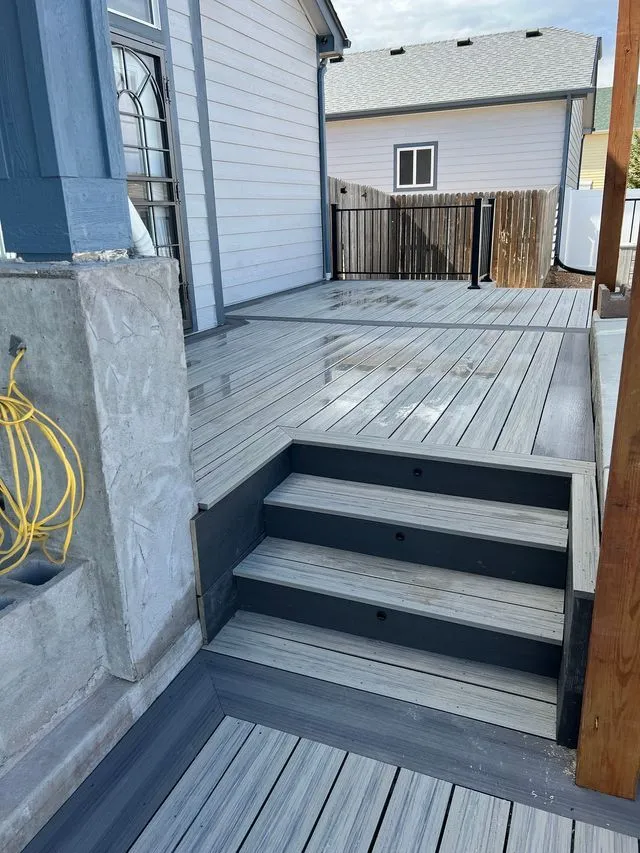Composite deck stairs with black railing